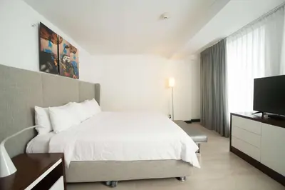 a hotel room with a bed and a television at Radisson Hotel Decapolis Miraflores in Lima