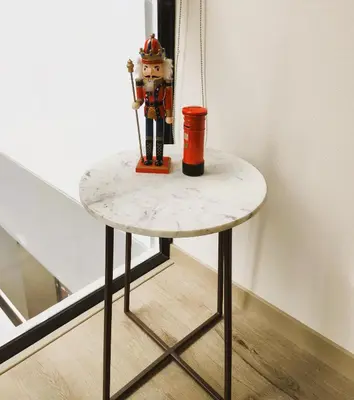 a small table with a toy on top of it at LA POSADA DE GUILLE LUXURY 1 HABITACION - Surco in Lima