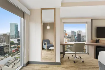 an office with a desk and a view of a city at Holiday Inn Express - Lima San Isidro by IHG in Lima