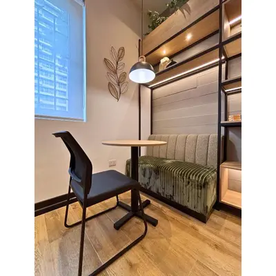 a table and a chair in a room at Sori Apartments in Lima