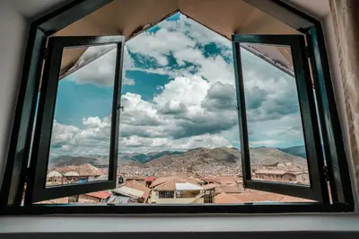 a view of a city from a window at Cusco Plaza Nazarenas in Cusco