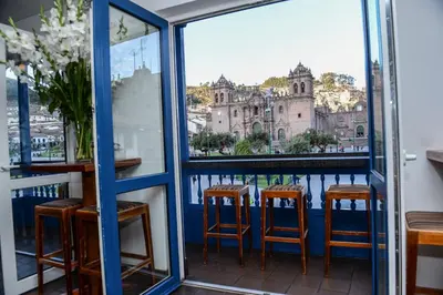 a view from the balcony of a bar with stools at Hotel Plaza de Armas Cusco in Cusco