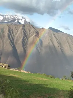 a rainbow in front of a mountain at Casafranca in Ollantaytambo