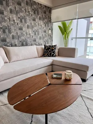 a living room with a couch and a coffee table at El Golf los inkas luxury Penthouse in Lima