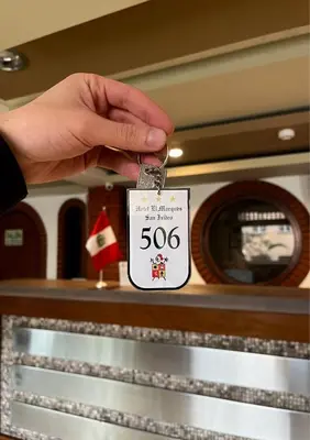 a person holding a speed limit sign on a table at Hotel El Marqués in Lima