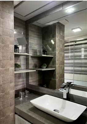 a bathroom with a sink and a large mirror at Hotel El Marqués in Lima