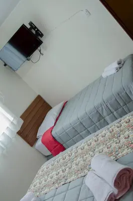 an overhead view of a bed in a room at Jazmines Lodging in Ica