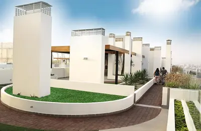 a building with people walking on a roof at Lima Flats in Lima