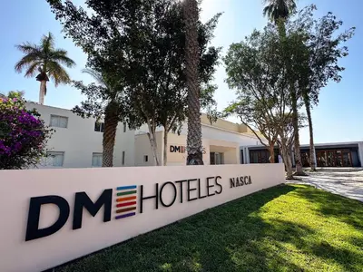 a sign in front of a building at DM Hoteles Nasca in Nazca