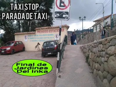 a car parked on a sidewalk next to a sign at Casa Mirador guesthouse in Cusco