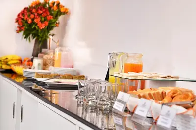 a buffet with food and drinks on a counter at Ankawa Hotel Boutique in Cusco