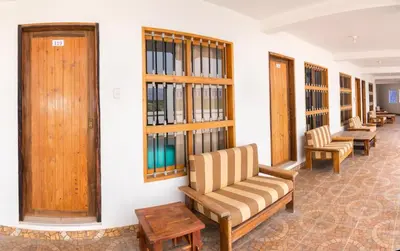 a waiting room with a couch and chairs at Bodega el Huarango in Ica