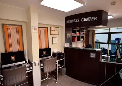 an office with a business center with two computers at qp Hotels Lima in Lima
