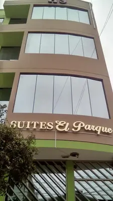 a building with a sign on top of it at Suites El Parque in Lima