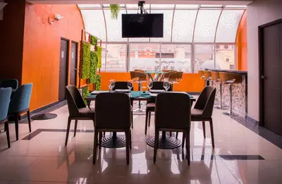 a dining room with a table and chairs at Hotel Diamond Lima in Lima
