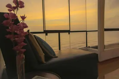 a couch in a room with a view of the ocean at Oceanfront Penthouse in Miraflores in Lima
