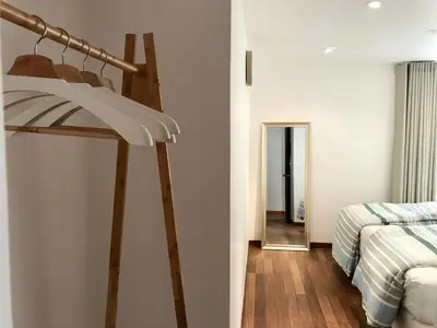 a bedroom with a ladder next to a bed at InkaHuset Pacasmayo in Lima