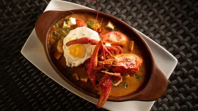 a bowl of food with shrimp and an egg on a plate at La Confianza Hotel in Lunahuaná