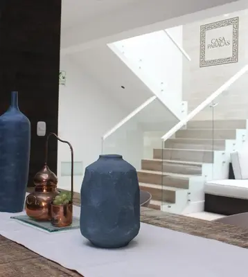 a group of vases sitting on top of a table at Casa Paracas in Paracas