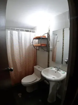 a bathroom with a toilet and a sink at Hatun Quilla in Cusco