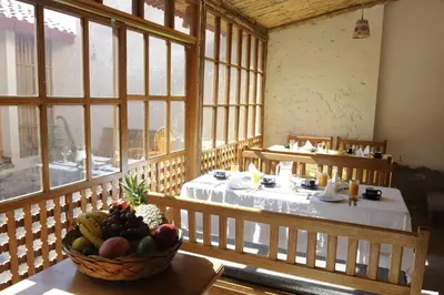 a room with a table with a bowl of fruit at Maison Fortaleza in Cusco