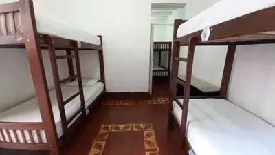 a room with two bunk beds in a room at Samanai Wasi in Lima