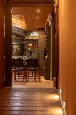 a dining room with a table and chairs at MOAF Cusco Boutique Hotel in Cusco
