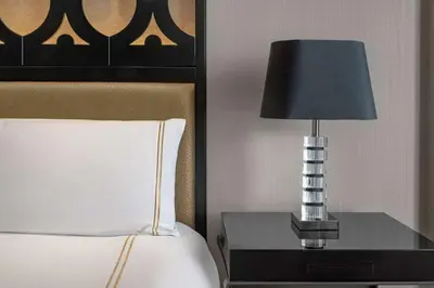 a lamp on a side table next to a bed at Hilton Lima Miraflores in Lima