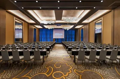 a conference room with rows of tables and chairs at Hilton Lima Miraflores in Lima