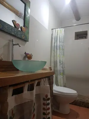 a bathroom with a sink and a toilet at Mágico lugar en el Valle Sagrado in Cusco