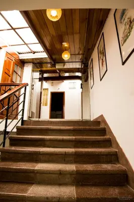a set of stairs in a building with a stair case at Hotel San Pedro Plaza in Cusco