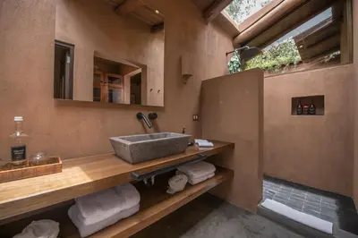 a bathroom with a sink and a mirror at Andenia Boutique Hotel, Sacred Valley in Urubamba