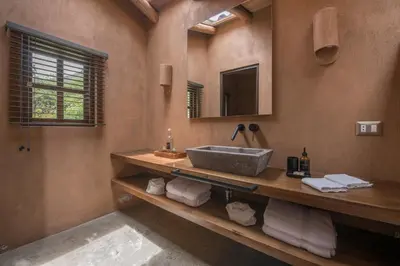 a bathroom with a sink and a mirror at Andenia Boutique Hotel, Sacred Valley in Urubamba