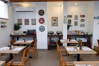 a dining room with wooden tables and chairs at Tierra Viva Miraflores Centro in Lima