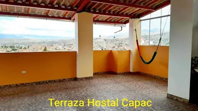 an empty room with a view of a city at Hostal Capac in Ayacucho