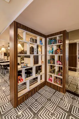 a dining room with a dining table and a room with shelves at Arawi Miraflores Express in Lima