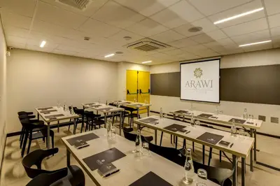 a dining room with tables and chairs and a chalkboard at Arawi Miraflores Express in Lima