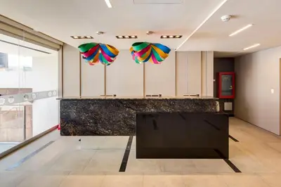 a room with umbrellas hanging from the ceiling at Arawi Miraflores Express in Lima