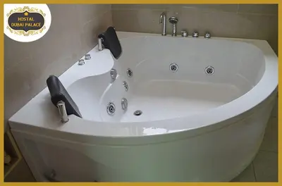 a large white bath tub in a bathroom at Dubai Palace in Lima