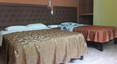 a bedroom with two beds at Dubai Palace in Lima