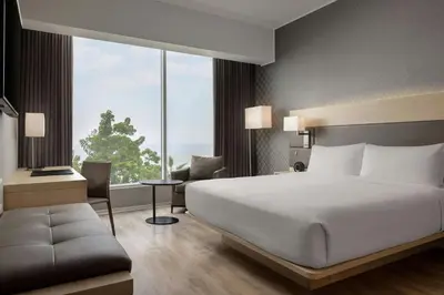 a bedroom with a large bed and a large window at AC Hotel by Marriott Lima Miraflores in Lima