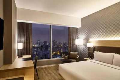 a hotel room with a bed and a desk and a window at AC Hotel by Marriott Lima Miraflores in Lima