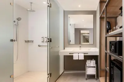 a bathroom with a sink and a shower at AC Hotel by Marriott Lima Miraflores in Lima