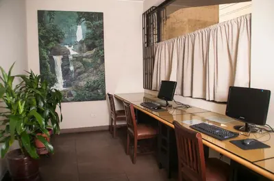 an office with two desks with computers on them at Hotel Ferrua in Lima
