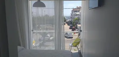 a room with a window with a view of a street at Coco Lodge Paracas in Paracas