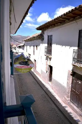 a view of a street with a sign on a building at La Estación San Pedro in Cusco