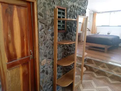 a room with a door and a room with a bed at Casa Inka B&B in Ollantaytambo