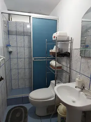 a bathroom with a toilet and a sink at Pawllu Inqa Lodge in Cusco