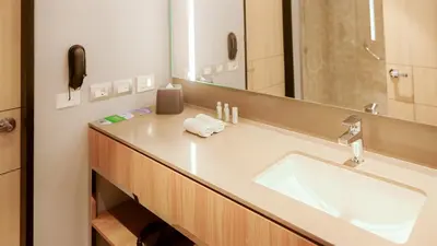 a bathroom with a sink and a mirror at Holiday Inn - Lima Miraflores by IHG in Lima