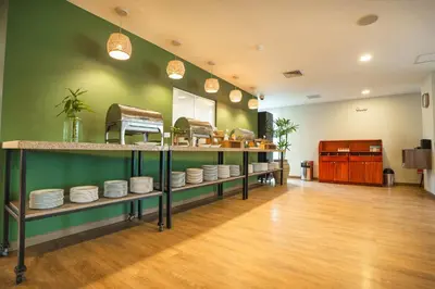 a room with shelves filled with dishes on display at Casa Andina Select Paracas in Paracas